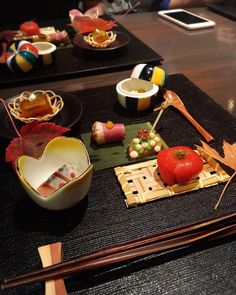 sushi and chopsticks sit on the table ready to be eaten