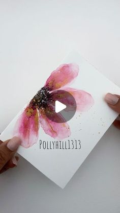 two hands holding up a card with a flower on it and the words polyvillille 13