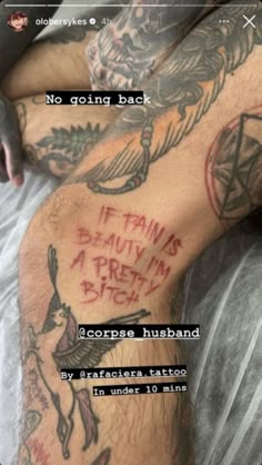 a man with tattoos on his legs and the caption reads, no going back