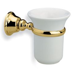 a white cup with a metal holder on it