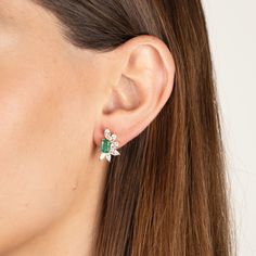 Our Helen earrings combine the timeless elegance of emeralds and diamonds in a contemporary design. Made with high quality cz diamonds and crystal emeralds set in gold plated sterling silver. Custom backs ensure the earrings sit perfectly on the ear. .6" L x .4" W Pierced. Stud style earrings Please contact us to special order larger quantities. Green Diamond Earrings For Evening, Classic Green Diamond Earrings, Luxury Emerald Earrings With Diamond Accents, Elegant Green Diamond Earrings, Green Diamond Earrings For Parties, Formal Green Diamond Cluster Earrings, Luxury Green Diamond Earrings With Accents, Timeless Green Jewelry With Baguette Diamonds, Fine Jewelry Green Diamond Earrings