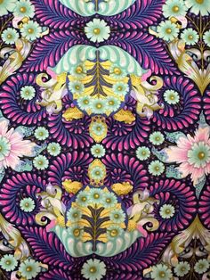 an intricately designed wallpaper with flowers and leaves on purple, blue, yellow and green colors