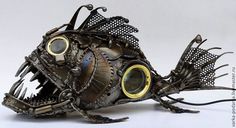 a sculpture of a fish made out of metal parts and other things that are attached to it's body