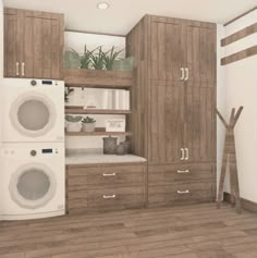 a laundry room with washer and dryer in the corner, next to cabinets