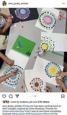 two children are making art with paper and glue on the table, while another child is using scissors to cut out circles