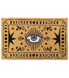 a door mat with an eye and stars on the front, in black and yellow