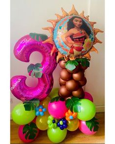 the number three is surrounded by balloons and decorations