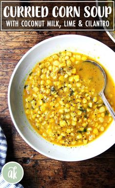 two bowls of corn soup on a wooden table