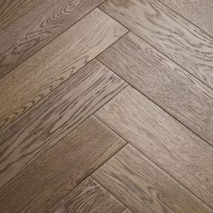 an image of wood flooring that looks like herringbones