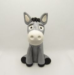 a toy horse sitting on top of a white table