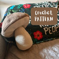 a stuffed animal sitting on top of a bed next to a pillow with the words crochet pattern