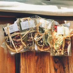 several packaged food items sitting on top of a wooden table