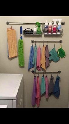 a laundry room with towels hanging on the wall