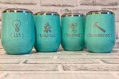 four teal colored tumblers with the words toasted and i'm mine on them