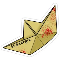 an origami paper boat with the word sg george on it's side