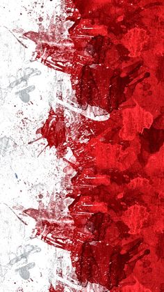 an abstract red and white background with paint splattered on it's edges