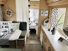 the interior of a camper is decorated with polka dots and black and white accessories