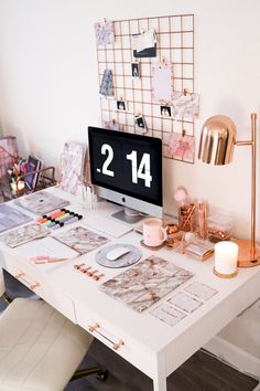 a white desk topped with a computer monitor