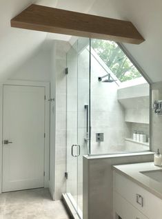 a bathroom with a skylight above the sink