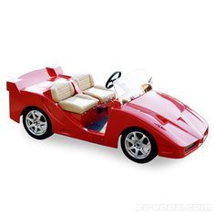 a red toy car with two seats and steering wheel on a white background, side view