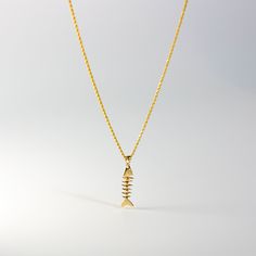 *The pendant COMES WITH the chain if you select one of our chain options *5% OFF TOTAL PRICE, when you purchase the chain and pendant combo (The price shown is after the discount) Cute and unique, you'll love this solid gold pendant as your unique gold pendant for casual day. Featuring a handmade and hand-polished fishbone, this 14K solid gold pendant is the perfect way to level up your day-to-day outfits. It's super casual yet unique and will make for a perfect conversation piece. Charlie & Co Unique Gold Pendant, Fishbone Necklace, Fish Bone Necklace, Bone Necklace, Bone Pendant, Statement Choker, Gold Copper, Beaded Choker Necklace, Necklace Charm