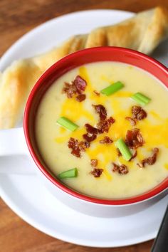 a bowl of potato soup with bacon and cheese