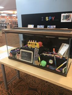 the display case is filled with school supplies