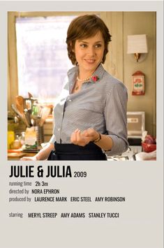 a woman standing in front of a kitchen counter with an advertisement for the movie julia