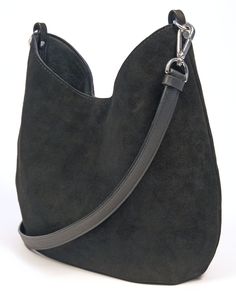 "This beautiful and luxuriously soft suede hobo bag will be a fashionable and chic addition to any ensemble. Crafted from a premium calf suede and fully lined with cotton canvas. This bag also features (2) interior 7\" zipper pockets, crossbody or shoulder strap, snap closure, pleats on bottom, silver hardware and hand painted edges. Handmade in Denver, CO. USA Dimensions: Width at widest- 14\" Height at tallest- 13\" Weight- 1 lb. 9 oz. Not finding exactly what you want? Sean Ray can make it fo Chic Suede Bag For On-the-go, Chic Suede Bucket Bag With Removable Pouch, Chic Suede Hobo Bag With Leather Handles, Modern Suede Hobo Bag With Double Handle, Chic Suede Hobo Bag, Modern Double Handle Suede Hobo Bag, Chic Suede Hobo Bag With Removable Pouch, Elegant Suede Bucket Bag Tote, Chic Suede Bucket Bag For Everyday