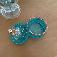 two blue dishes sitting on top of a wooden table