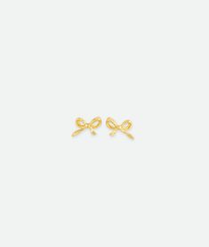 The Bow Studs add a touch of elegance to any outfit. Crafted in a delicate bow design, they’re lightweight and comfortable for all-day wear. A timeless, versatile accessory perfect for any occasion. 14k Gold Plated Sterling Silver Base Lead & Nickel Free Length 0.35" | 9 mm Width: 0.27" | 7mm Hypoallergenic Titanium Posts Valentina Rose, Charm Rings, Bead Charm Bracelet, Bow Design, Chain Choker, Gold Earrings Studs, Jewelry Bags, Gold Plated Sterling Silver, Gold Material