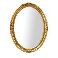 an oval gold mirror with ornate detailing