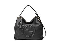 This black Gucci bag exudes luxury with its beautiful leather and gold-toned hardware. The famous interlocking GG logo is displayed proudly on the front. With a zipper pocket and two open pockets befitting of a phone, you'll have space to organize what you need to bring with you.     Model: 536194     Black Leather  Gold-tone Hardware  GG Soho  Top Zip Closure  Leather Shoulder Strap  Removable/Adjustable Shoulder Strap  Three Interior pockets  Strap Drop: 5"   Measurements: 13.5" x 5.5" x 13" ( Gucci Shoulder Bag With Logo Hardware For Business, Gucci Crossbody Shoulder Bag With Logo Hardware, Gucci Rectangular Bag With Logo Hardware, Gucci Shoulder Bag With Logo, Rectangular Gucci Bag With Logo Hardware, Gucci Shoulder Bag With Logo Hardware, Gucci Leather Shoulder Bag With Logo Hardware, Gucci Shoulder Bag With Logo Hardware For Everyday Use, Gucci Crossbody Bag With Logo