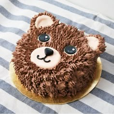 a cake with chocolate frosting and icing that looks like a bear