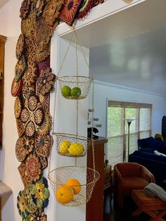 there is a hanging fruit basket on the wall in the living room with other items