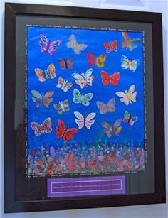 a painting with many butterflies on it in a black frame and purple trim around the edges