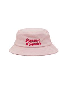 Wear your heart on your sleeve — or your head with our Romance Reader bucket hat! Product Details 100% terry cotton Embroidered artwork Color: light pink One size fits most Designed by Brittany Paige This print-on-demand product is made especially for you as soon as you order it. The Print Shop: FAQs Ordering & Shipping We cannot make any cancellations or changes to Print Shop orders for any reason. Most orders will be processed within 2 to 5 business days in addition to the shipping time for th Casual Pink Hats With Letter Print, Pink Cotton Hat With Embroidered Logo, Trendy Pink Hat With Embroidered Logo, Casual Pink Bucket Hat One Size, Pink Hats With Letter Print And Curved Brim, Trendy Pink Bucket Hat With Curved Brim, Pink Curved Brim Hat With Letter Print, Trendy Pink Cotton Hat, Pink Cotton Bucket Hat For Spring