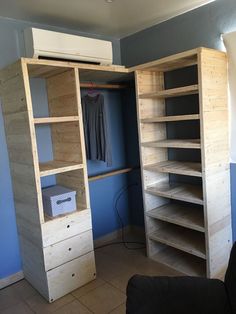 a room with some shelves and drawers in it