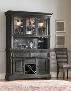 a black china cabinet with wine glasses on it