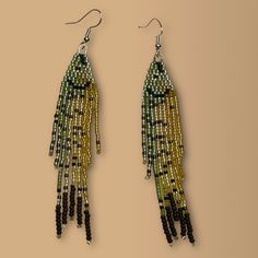 two pairs of earrings with beads hanging from them