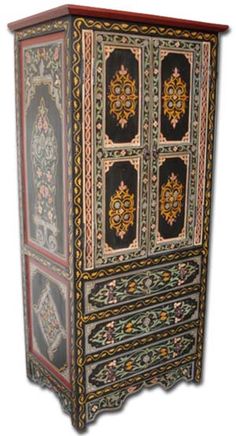 an ornately decorated armoire with drawers