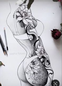 a pencil drawing of a woman's torso with flowers on the side and an arm tattoo