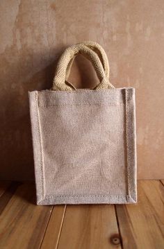 a white bag sitting on top of a wooden floor