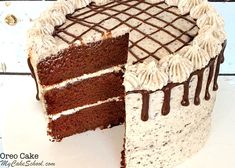 a chocolate cake with white frosting on a plate