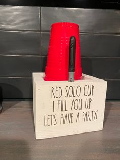 a red solo cup i fill you up and let's have a party sign