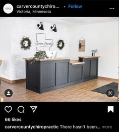 the front desk of a salon with wreaths on it's wall and two chairs