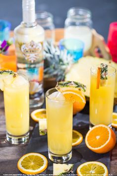 two glasses filled with lemonade and orange slices