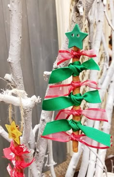 a christmas tree made out of branches and ribbons