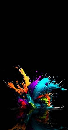 colorful paint splashing on the black surface