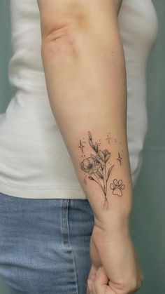 a woman with a flower tattoo on her arm